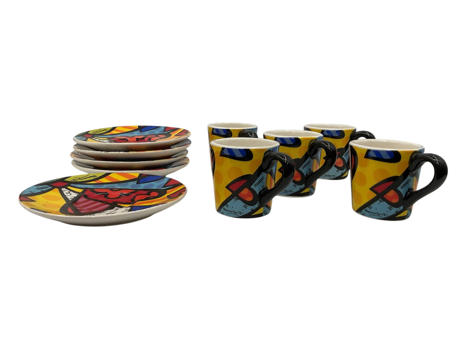 Romero Britto A New Day Espresso Set: Colorful Romero Britto A New Day espresso set comprising five espresso cups and five matching saucers. Crafted in ceramic, each piece features Britto’s signature pop-art aesthetic with bold