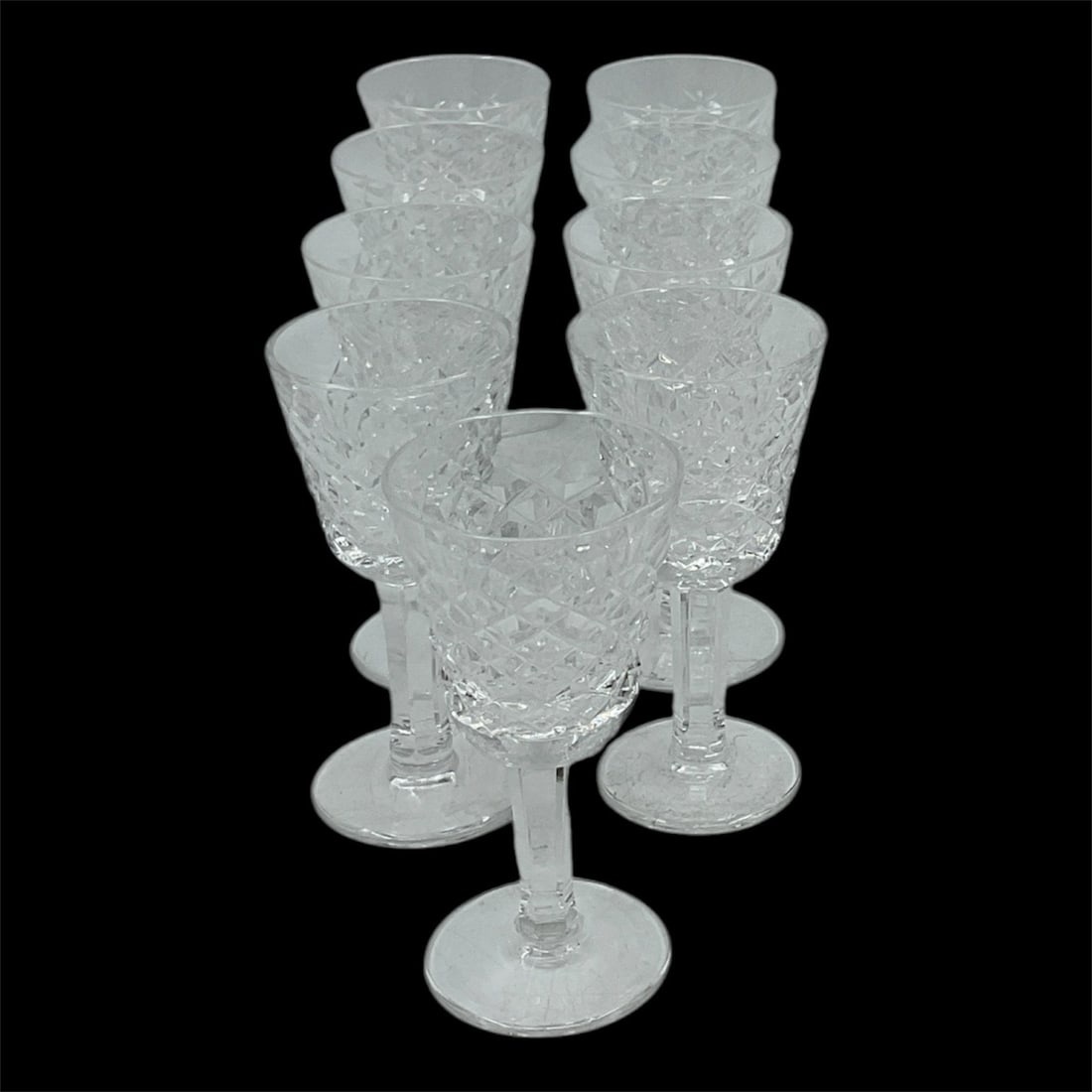 Waterford Crystal Cut Glass Cordial Glasses, Set of 9: An elegant set of nine Waterford crystal cordial glasses, finely crafted with intricate cut patterns that enhance their brilliance and clarity. The petite size and refined design make them ideal for s