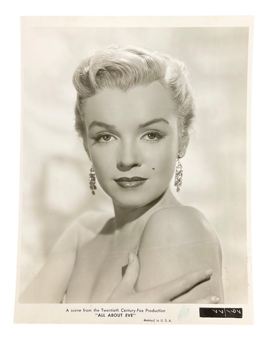 Marilyn Monroe (Columbia Pictures) (United States, 19261962) Silver Gelatin Print Type 1: A vintage silver gelatin publicity photograph of Marilyn Monroe for the 1950 Twentieth CenturyFox production "All About Eve." The portrait features a closeup of Monroe with her hand to her