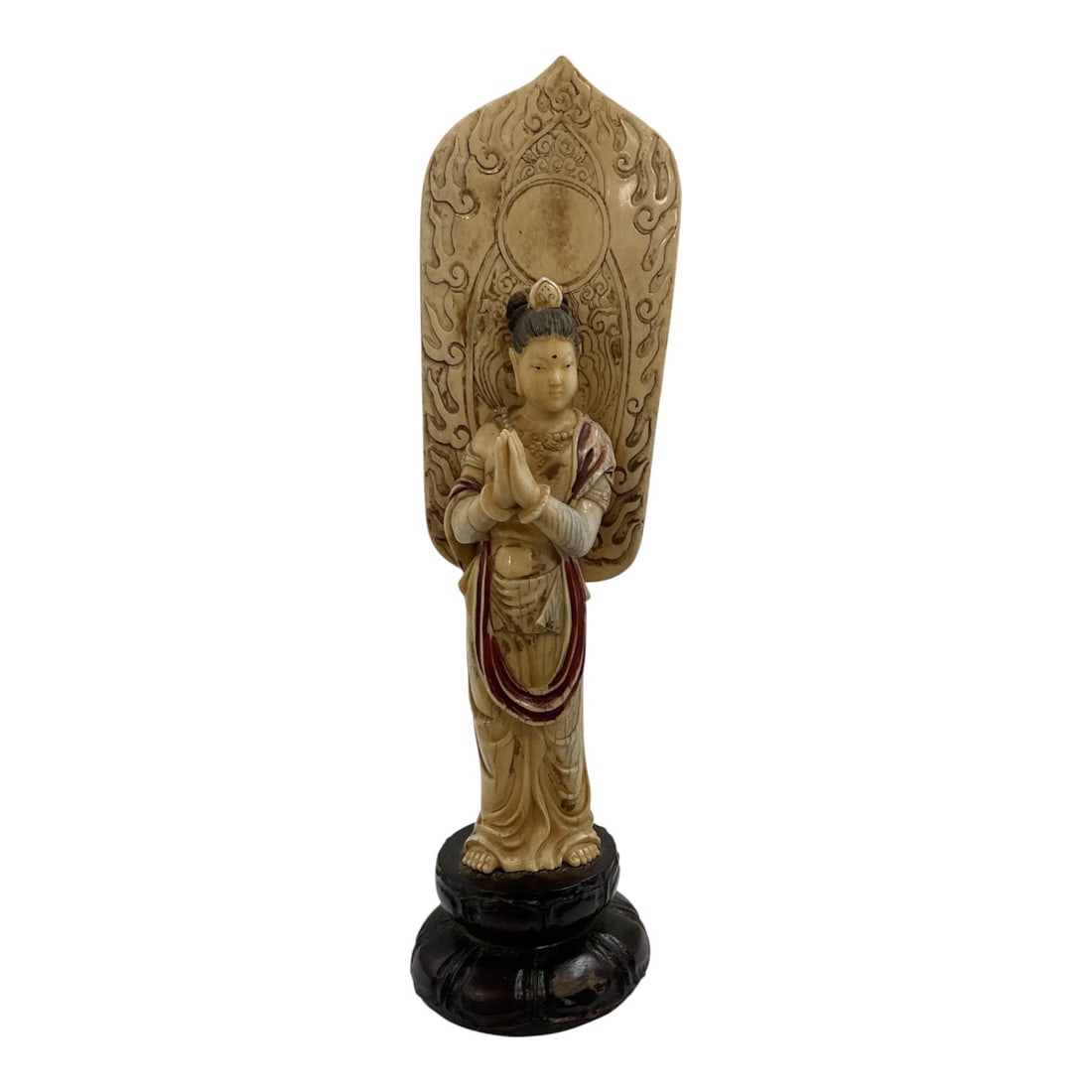 Asian-Style Carved Bodhisattva Figural Sculpture: A finely detailed Asian-style carved sculpture depicting a standing Bodhisattva or celestial figure posed before an ornate mandorla with scrolling floral and foliate decoration. The figure is dressed 