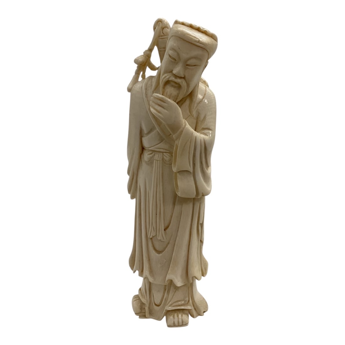 Asian-Style Carved Bearded Scholar Figural Sculpture: A finely detailed Asian-style carved sculpture depicting a standing bearded scholar or elder dressed in flowing traditional robes. The figure is posed with one hand stroking his long beard while carry