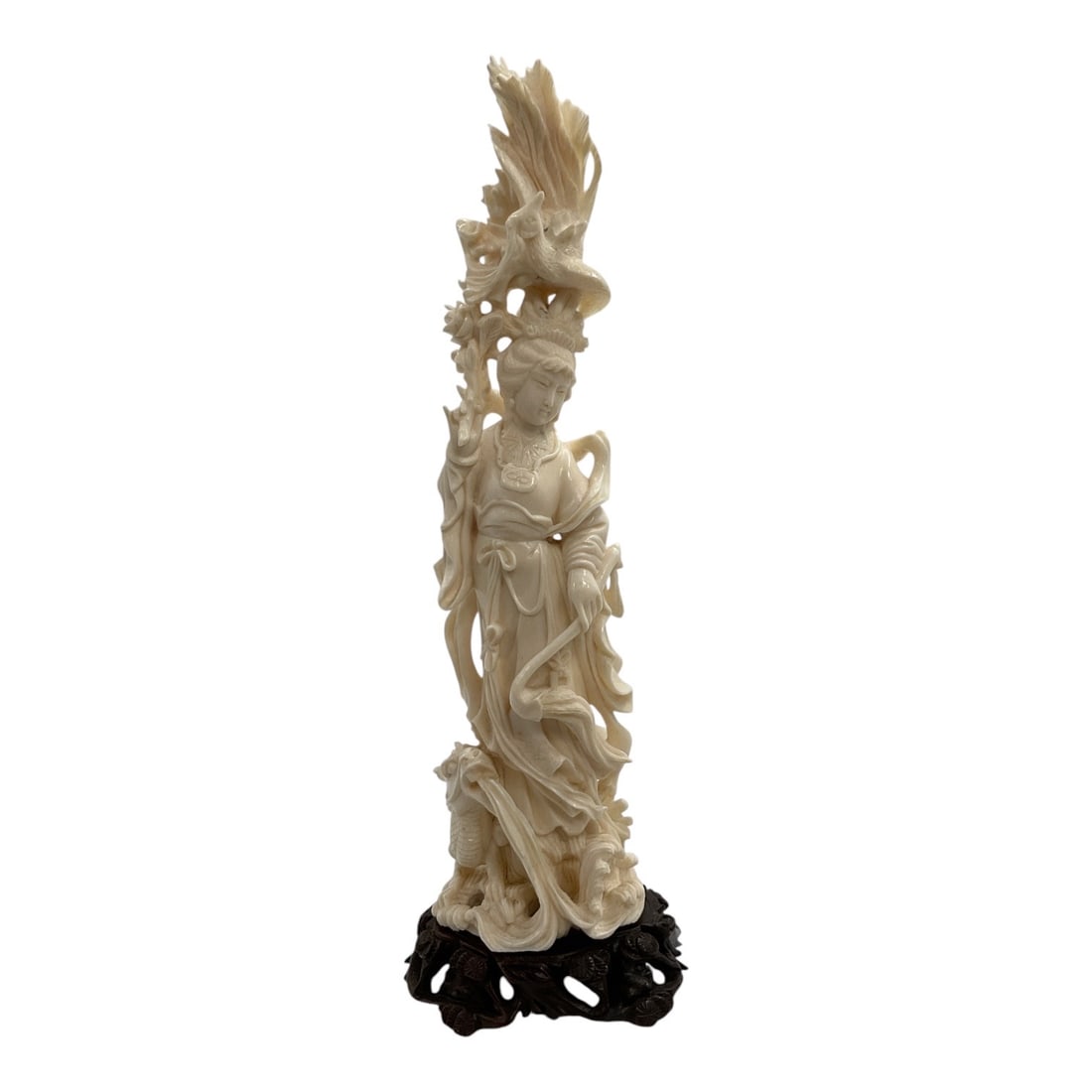 Asian-Style Carved Female Deity with Phoenix Sculpture: A finely detailed Asian-style carved sculpture depicting a standing female deity or celestial figure in flowing robes, surrounded by elaborate openwork decoration. A dramatic phoenix or mythical bird 