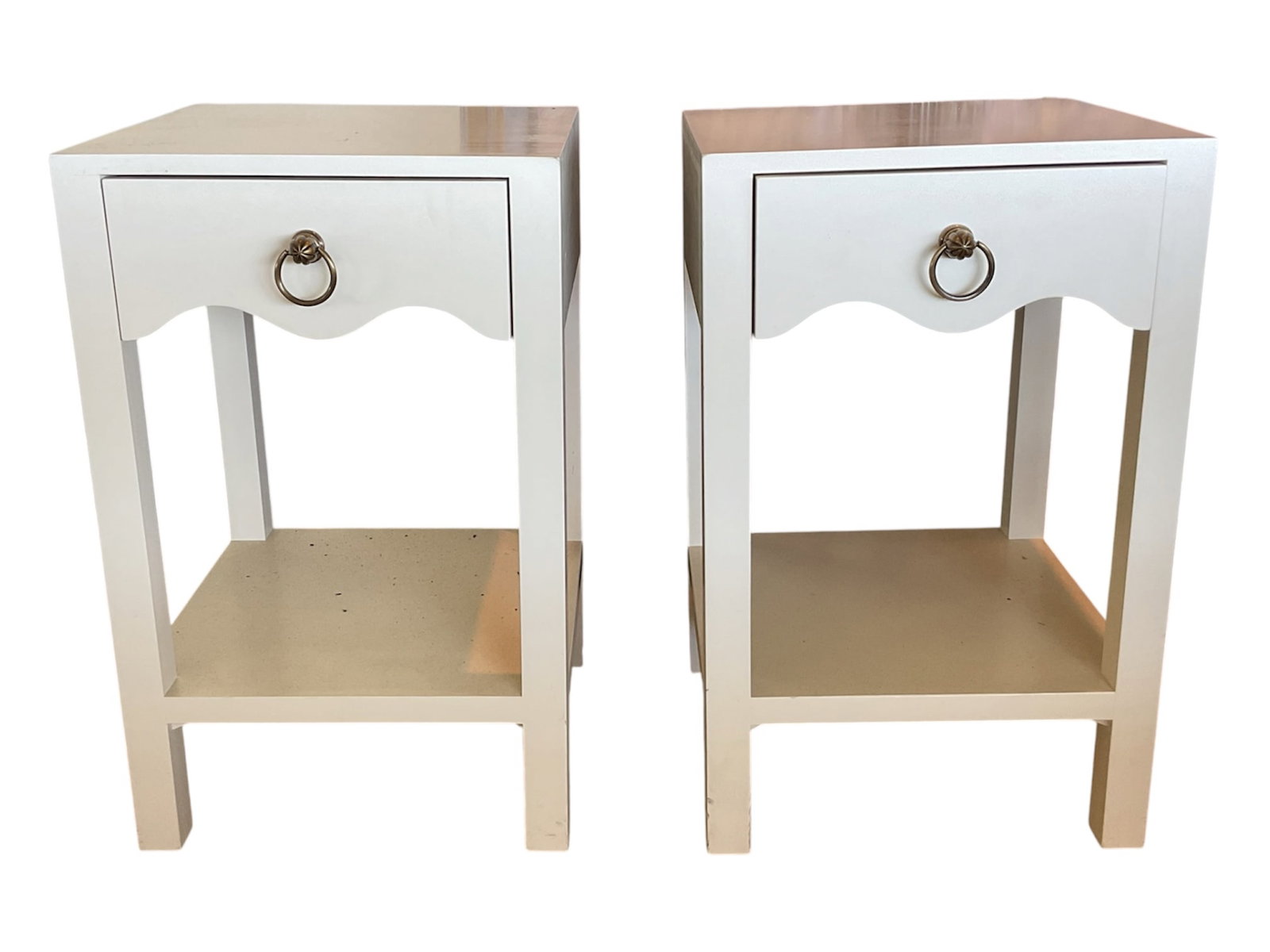 Matching end Pair of Modern Painted Nightstands / Side Tables: DescriptionA matching pair of modern single-drawer nightstands or side tables, finished in a soft off-white/cream painted tone. Each table features a clean-lined rectangular top over a single up