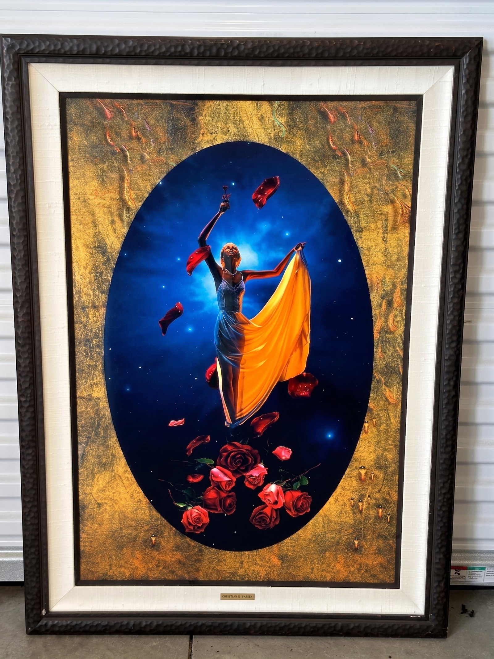 Bellarosa Christian Riese Lassen (American, B. 1949) Mixed Media: A surrealist mixed media composition centered on a stylized female figure in a flowing yellow dress set within a dark blue oval vignette filled with floating red roses, petals, and glowing stars. The 