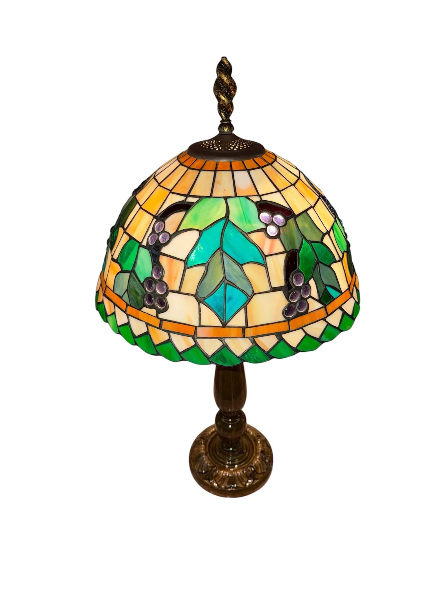 Art Nouveau Tiffany Style Leaded Glass "Grapevine" Two-Light Table Lamp: An elegant Tiffany-style leaded glass and cast table lamp featuring a vibrant, multi-colored slag glass dome shade. The shade showcases a geometric cream and amber tiled background, beautifully
