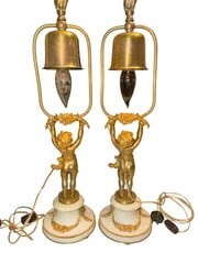 Pair of French Gilded Bronze & Marble Table Lamps: Pair of French table lamps crafted with gilded bronze mounts on white marble bases. Each lamp features an elegant urn-form body adorned with classical ribbon and foliate motifs, resting on a circular 