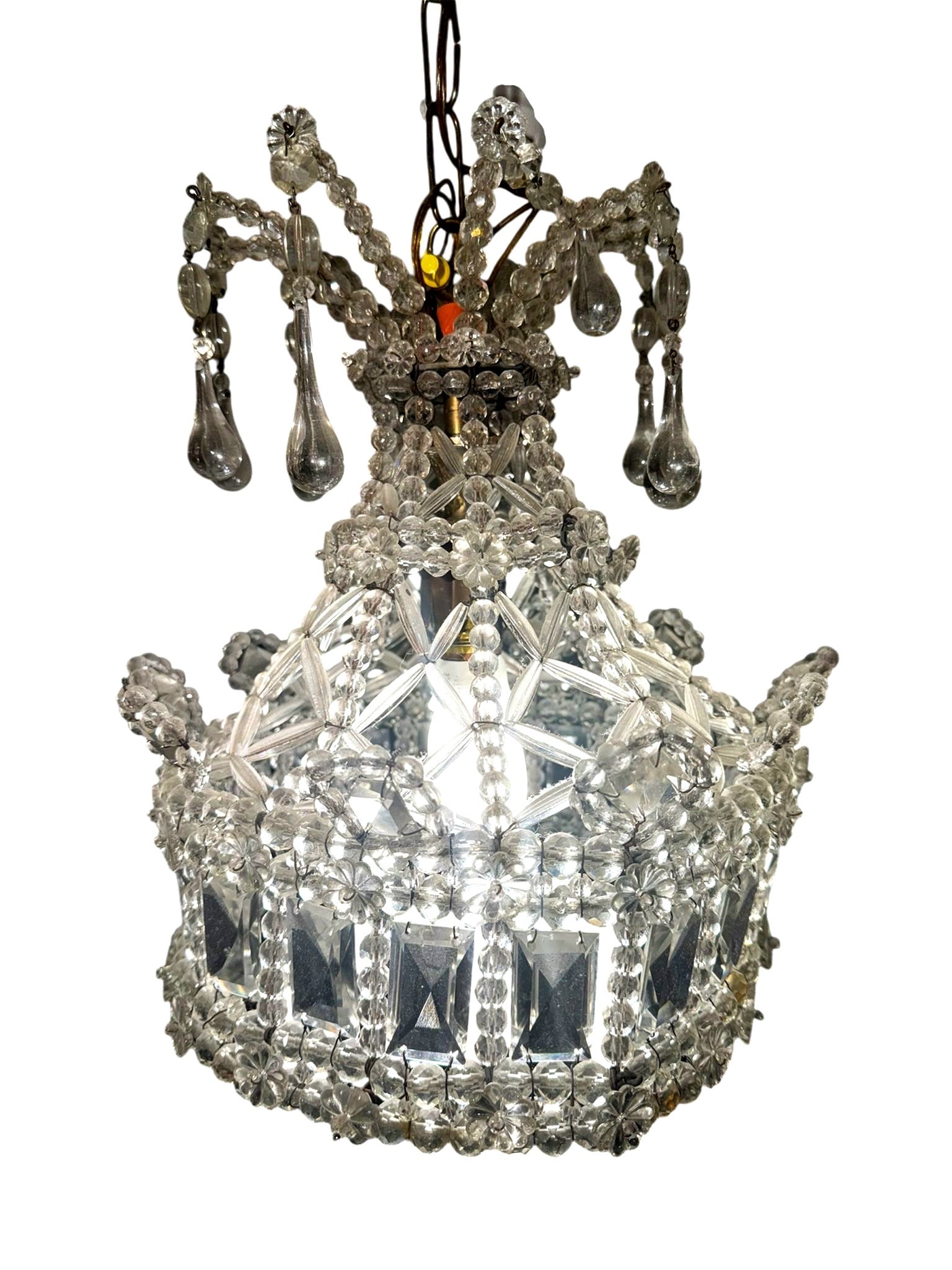 Maison Bagues Style French Hand-Made Chandelier 19th C.: This 19th-century French chandelier, designed in the Maison Baguès style, features a single central light socket within an open-form gilded bronze or brass frame. The structure is heavily ornam