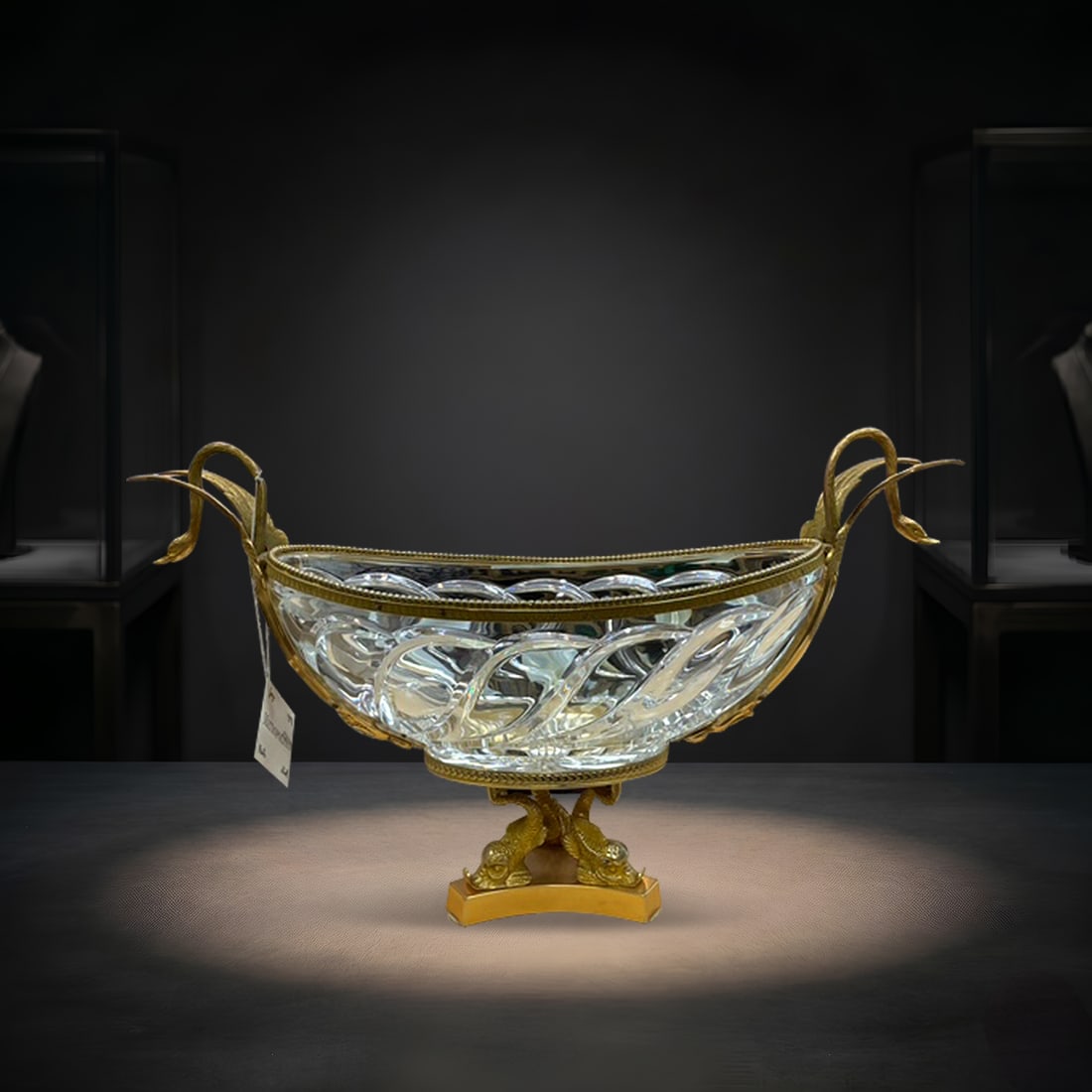 CS-531 Crystal Cut Glass Centerpiece Bowl with Gilt Swan Form Mounts: An elegant and visually striking crystal centerpiece bowl mounted in an ornate gilt metal frame featuring finely sculpted swan motifs. The oval cut glass bowl is richly decorated with intricate patter