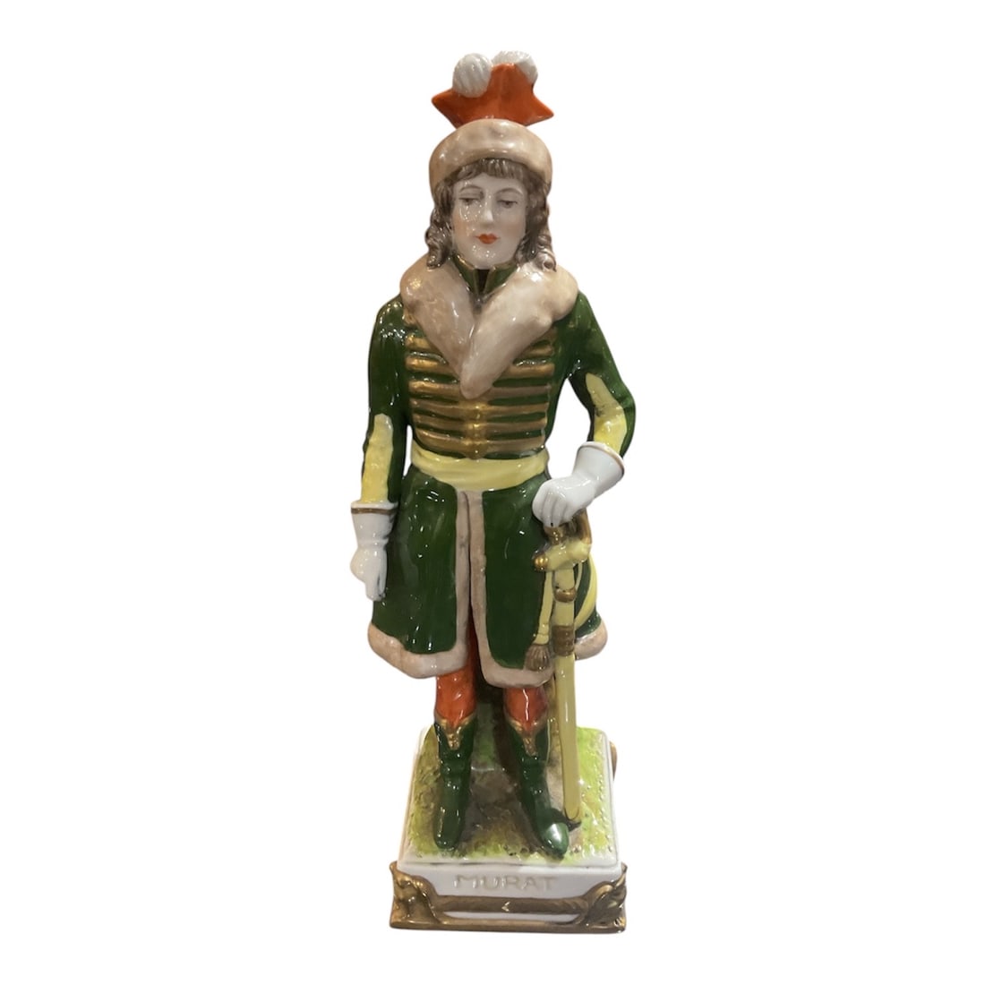 PC - Dresden Porcelain Figure of Gentleman in Green Coat: A finely modeled Dresden porcelain figure depicting a gentleman in traditional European attire, rendered with detailed hand-painted decoration and a strong sense of character. The figure stands u