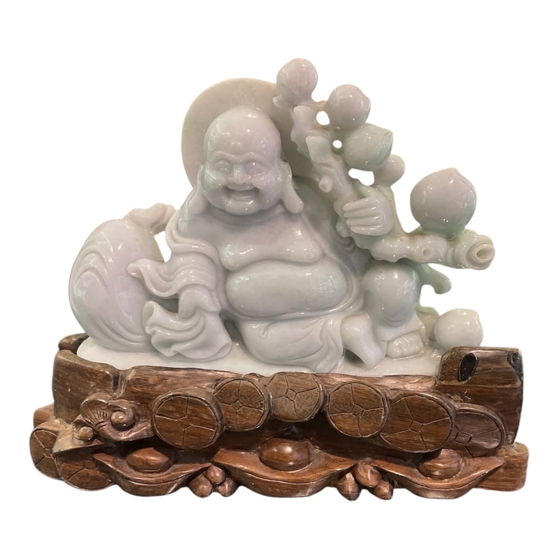 JD632 - Carved Jade Figure of Laughing Buddha on Hardwood Stand: A finely carved jade sculpture depicting the Laughing Buddha, a symbol of happiness, prosperity, and abundance in Chinese culture. This charming piece showcases both the natural beauty of jade and the