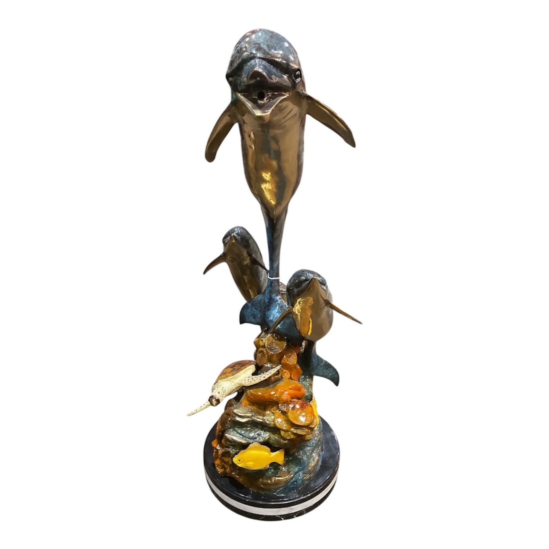 BR323 - Bronze Fountain Sculpture of Three Dolphins with Marine Life: A vibrant and dynamic bronze fountain sculpture featuring three dolphins in mid-leap, rising gracefully above a lively underwater scene. This striking piece captures the energy and movement of marine 