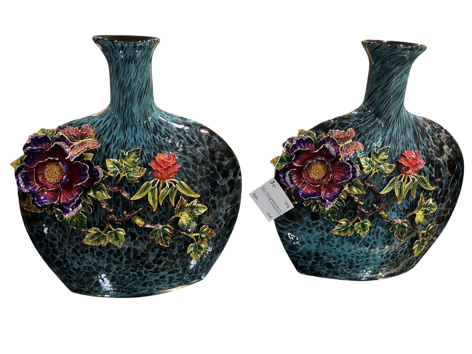 CS1054- Pair of Blue Crystal and Enamel Mounted Vases with Parrot Decoration: A striking pair of blue crystal vases adorned with elaborate enamel decoration featuring parrots and floral motifs, executed in a richly decorative European style. Each vase is formed with a distincti