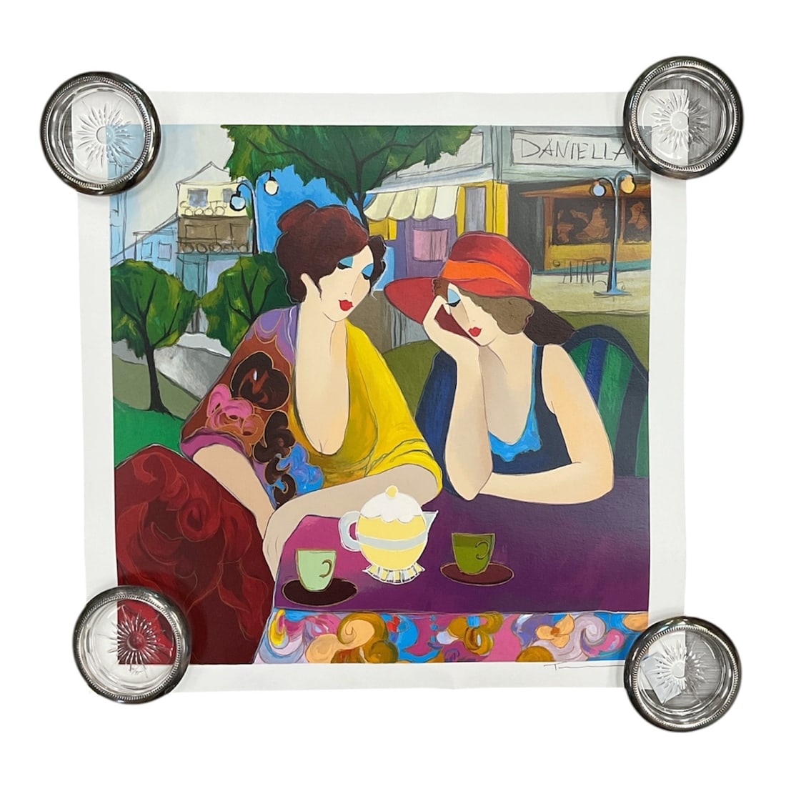 "Cafe Daniella" by Itzchak Tarkay (Yugoslavia, 1935–2012) Serigraph in Colors: DescriptionThis striking, elegant figurative graphic work is by the master Israeli impressionist Itzchak Tarkay. Set against an outdoor urban backdrop featuring a Parisian-style streetscape and a