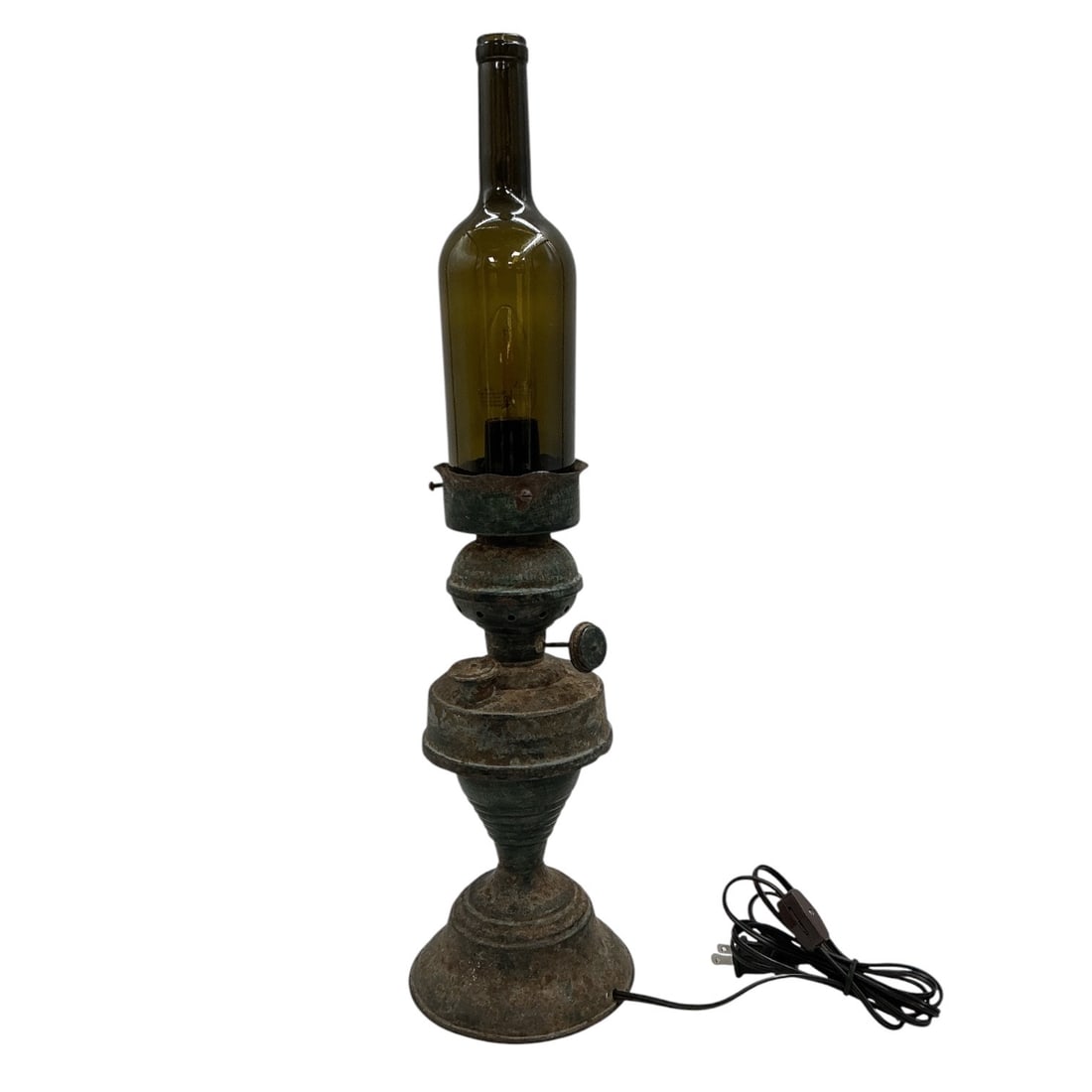 Handmade Rustic Wine Bottle Table Lamp: Decorative rustic wine bottle table lamp featuring an aged carved wood candlestick-style base topped with a green glass wine bottle serving as the lamp body. The combin