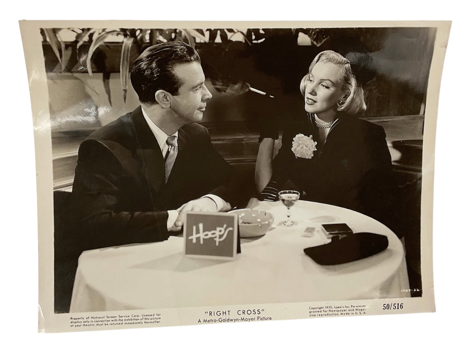 "Marilyn Monroe in 'Right Cross' with Dick Powell" Silver Gelatin Print.: A vintage silver gelatin production still photograph from the 1950 Metro-Goldwyn-Mayer sports drama film "Right Cross." Directed by John Sturges, the scene captures a memorable sequence feat