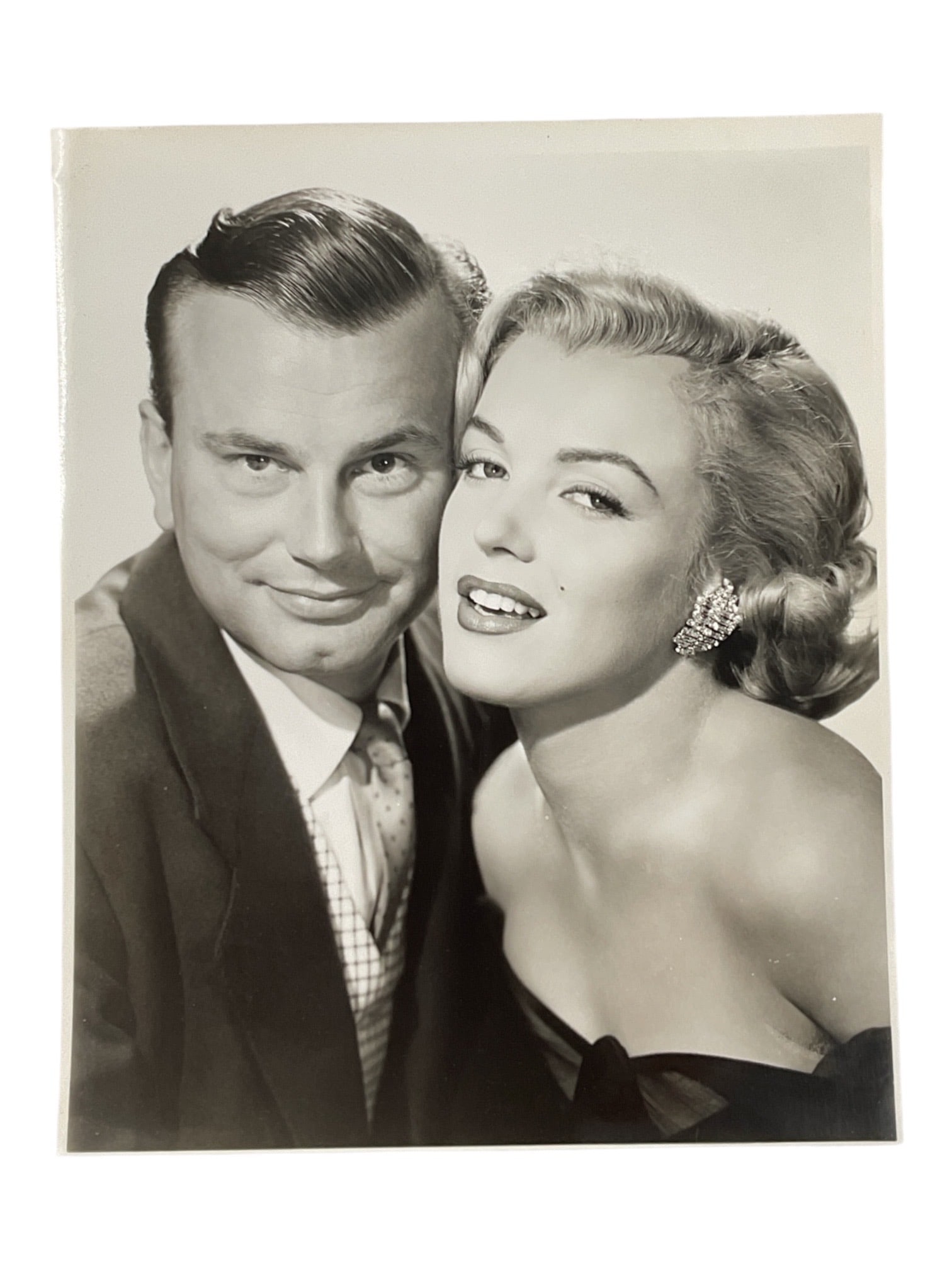 "Marilyn Monroe in 'How to Marry a Millionaire'" Silver Gelatin Print: A vintage silver gelatin production still photograph from the 1953 Twentieth Century-Fox romantic comedy film "How to Marry a Millionaire." The image captures Marilyn Monroe as Schatze Page 
