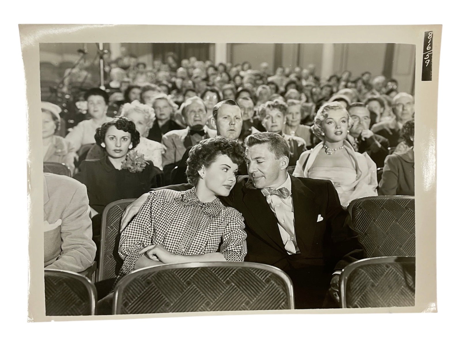 "Marilyn Monroe in 'As Young as You Feel' with Jean Peters and David Wayne" Silver Gelatin Print.: A vintage silver gelatin production still photograph from the 1951 Twentieth Century-Fox comedy film "As Young as You Feel." The image captures a prominent scene featuring cast members Jean 