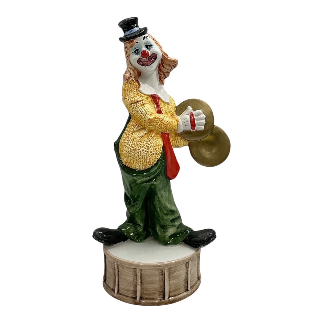 Capodimonte Porcelain Clown Cymbal Player Figurine: Decorative Capodimonte-style porcelain clown figurine depicting a cheerful clown standing atop a drum-form base while playing a pair of cymbals. The figure is hand-pai