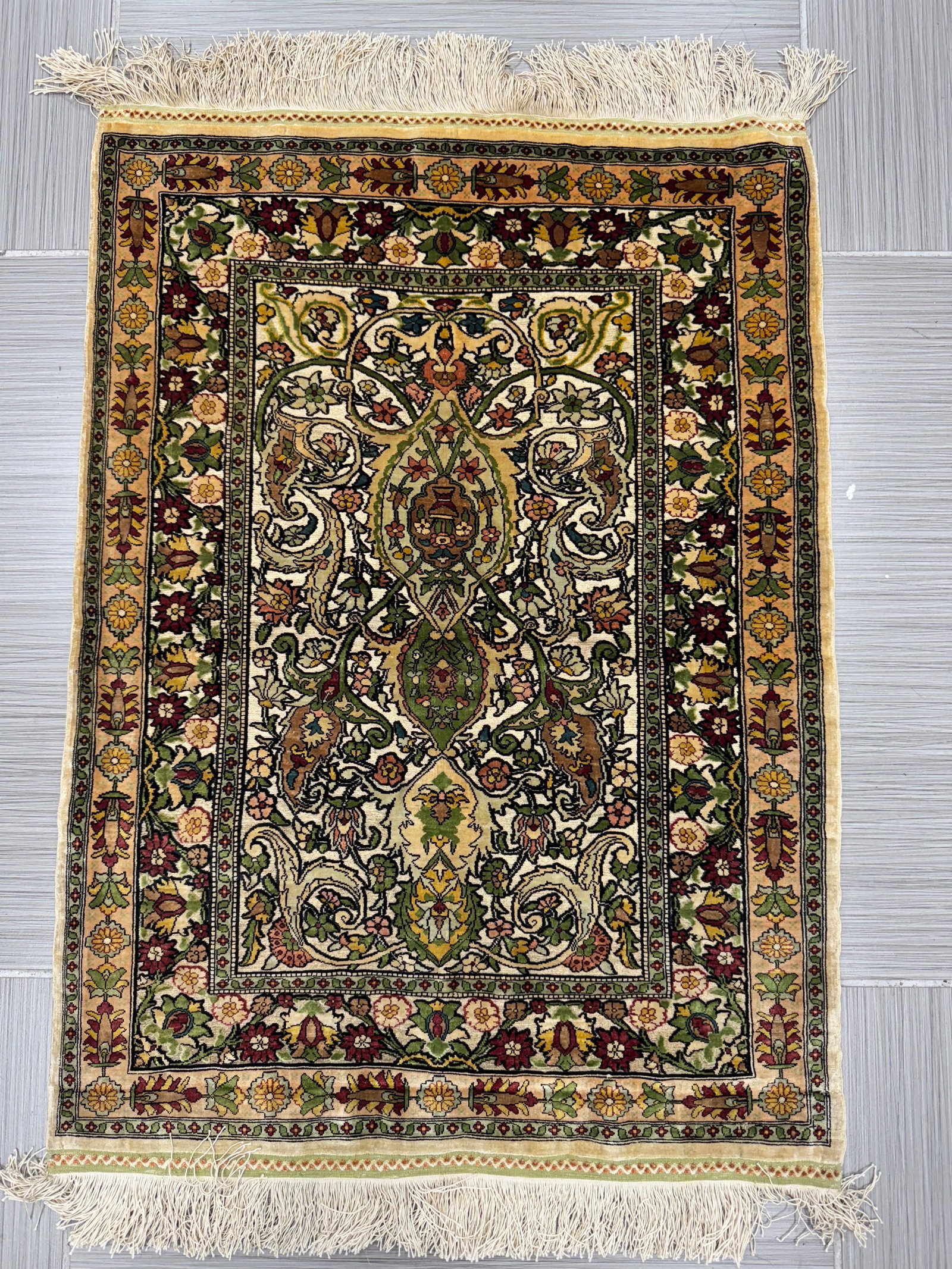 Hereke Turkish Silk Carpet Prayer Rug With Gold Threads: A fine Hereke Turkish silk carpet featuring an intricate floral design and fringe. Accompanied by original documentation, adding to its provenance and value. A beautiful example of Turkish