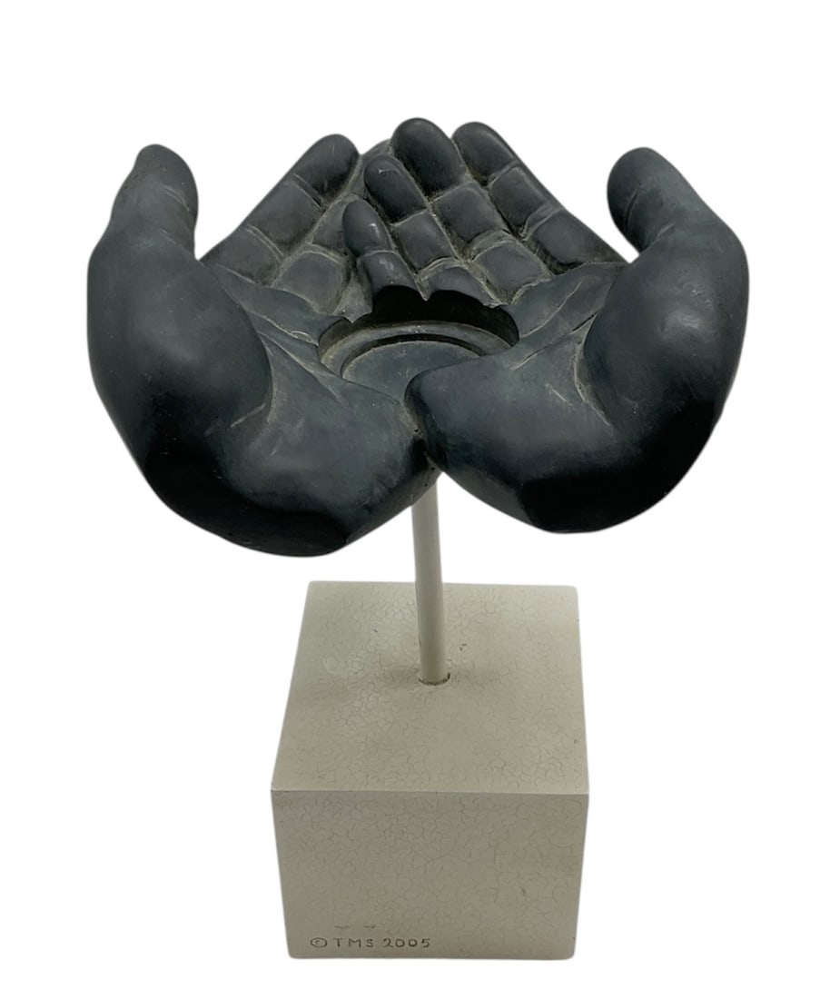 Cupped Hands Sculpture: This contemporary stone sculpture features two elegantly modeled 