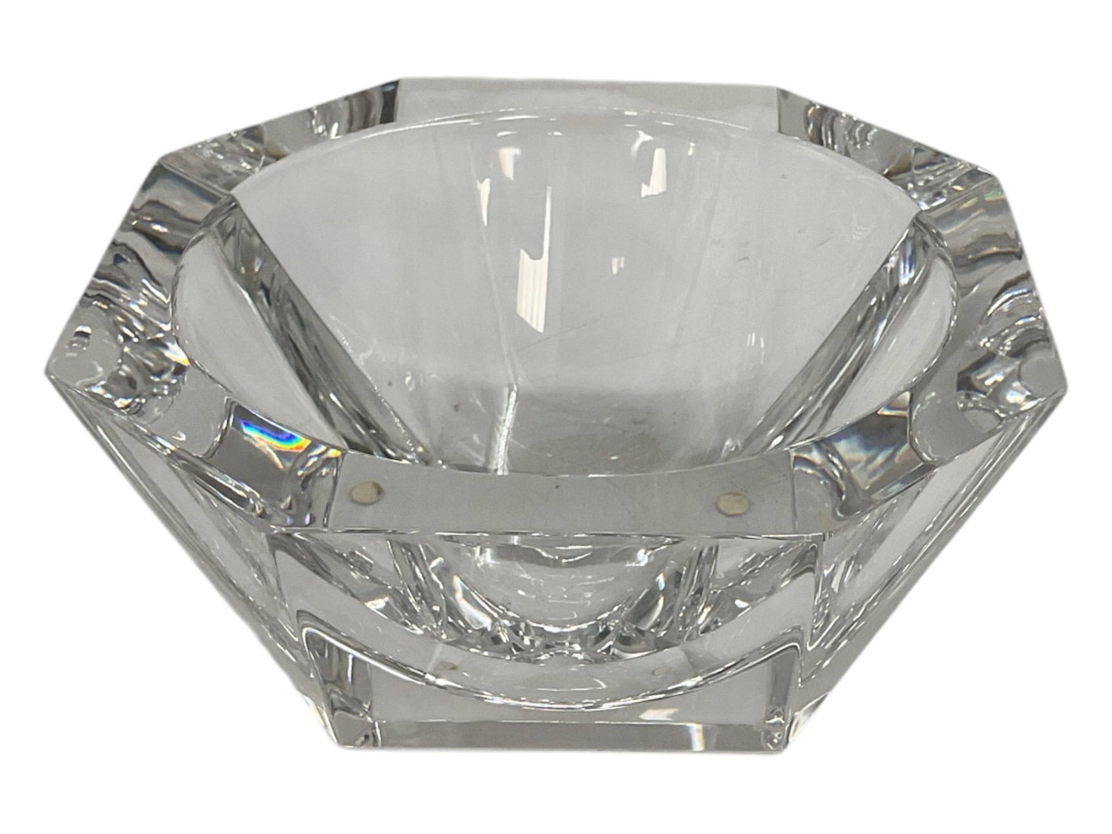 Large Faceted Clear Crystal Art Glass Bowl: Large decorative clear crystal bowl featuring a substantial geometric form with a deep rounded interior and bold faceted exterior. The thick crystal walls are cut into angular panels that beautifully 