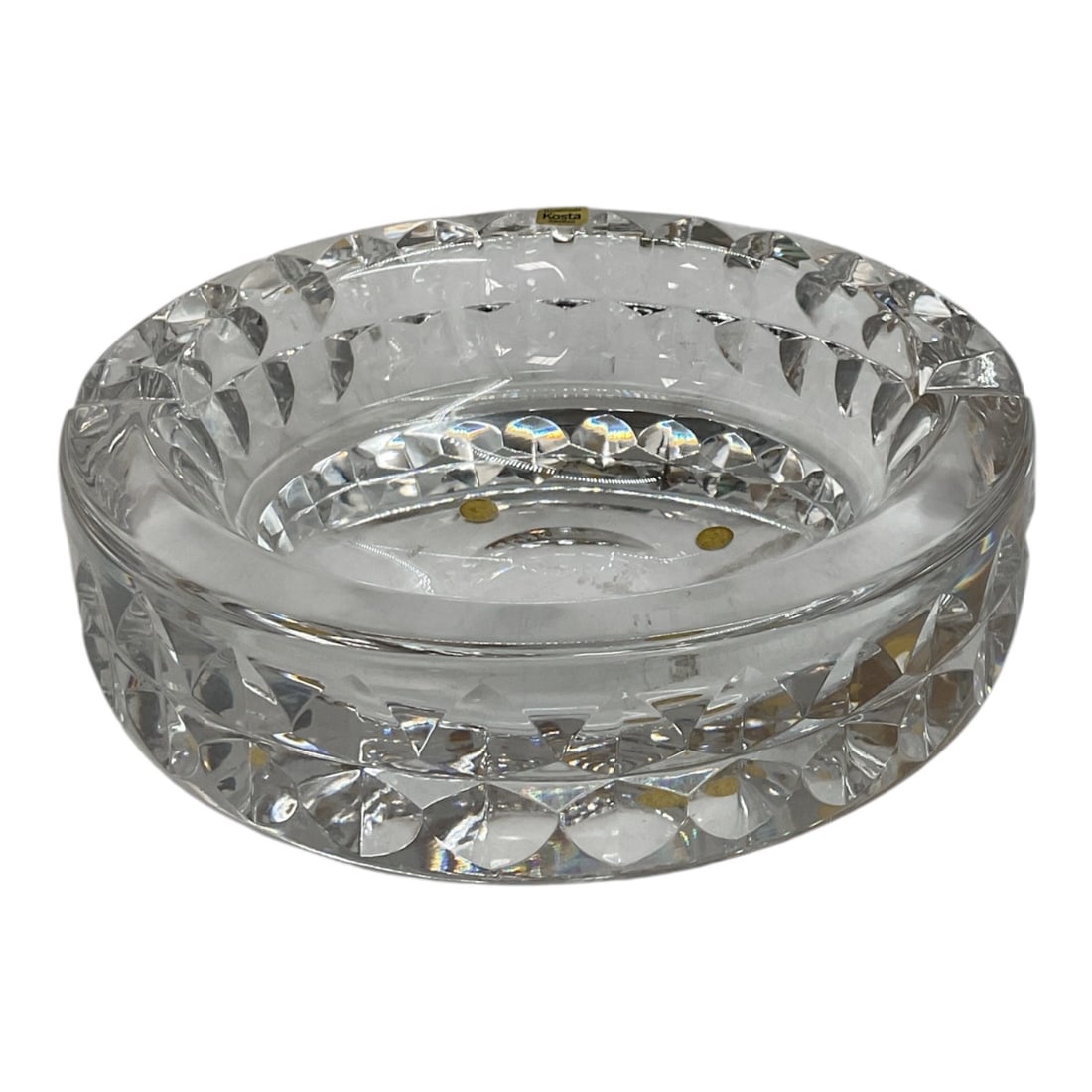 Handmade Kosta Sweden Cut Crystal Bowl: Handmade Swedish crystal bowl by Kosta, featuring a substantial circular form with deeply cut faceted decoration around the exterior and rim. The clear crystal construction creates brilliant light ref