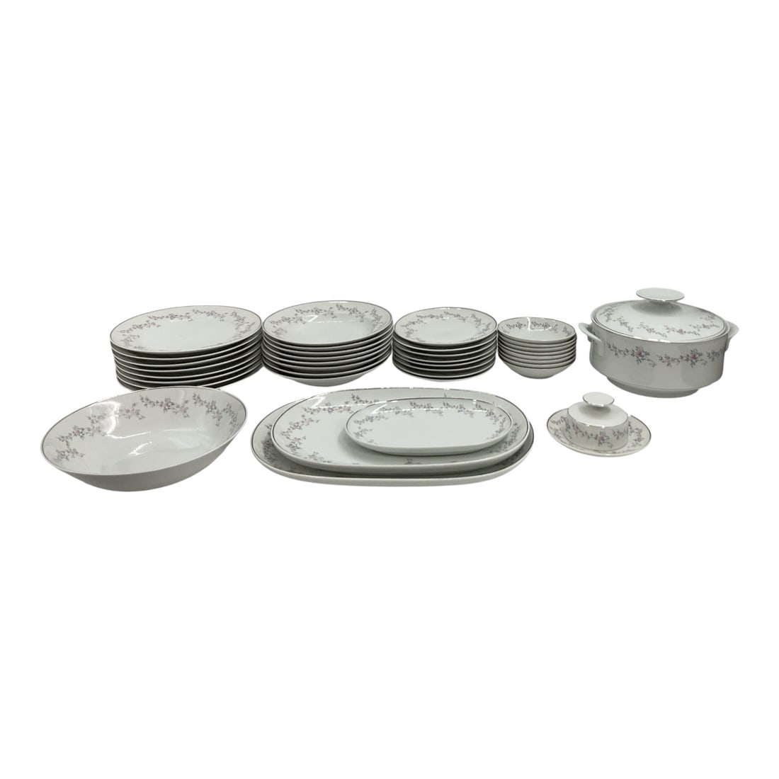 Porcelana Inter-American Brazilian Floral Porcelain Dinnerware Set: Extensive porcelain dinnerware service featuring a delicate pink and gray floral border with coordinating silver-tone rim accents. The set includes multiple sizes of dinner and serving plates, a large
