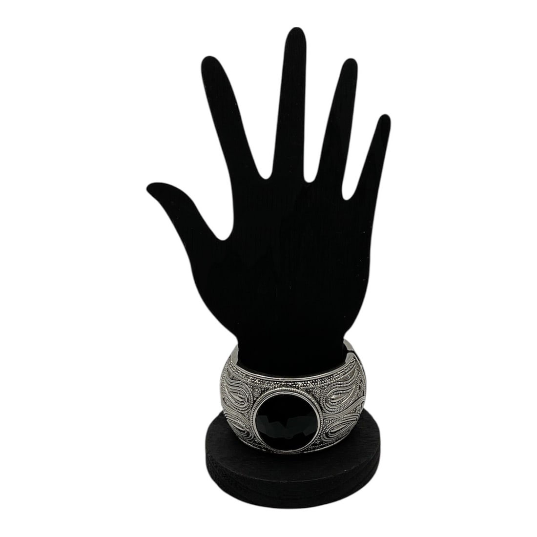 Wide Decorative Bangle Bracelet with Black Stone Accent: Bold decorative bangle bracelet featuring an ornate textured design with intricate scrolling and geometric motifs throughout. The piece is centered with a large faceted black stone, creating strong vi