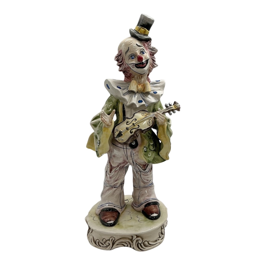 Capodimonte Porcelain Clown Guitarist Figurine: Whimsical Capodimonte porcelain clown figurine depicting a cheerful clown playing a guitar. The figure is hand-painted in soft shades of green, cream, gray, and gold, with expr