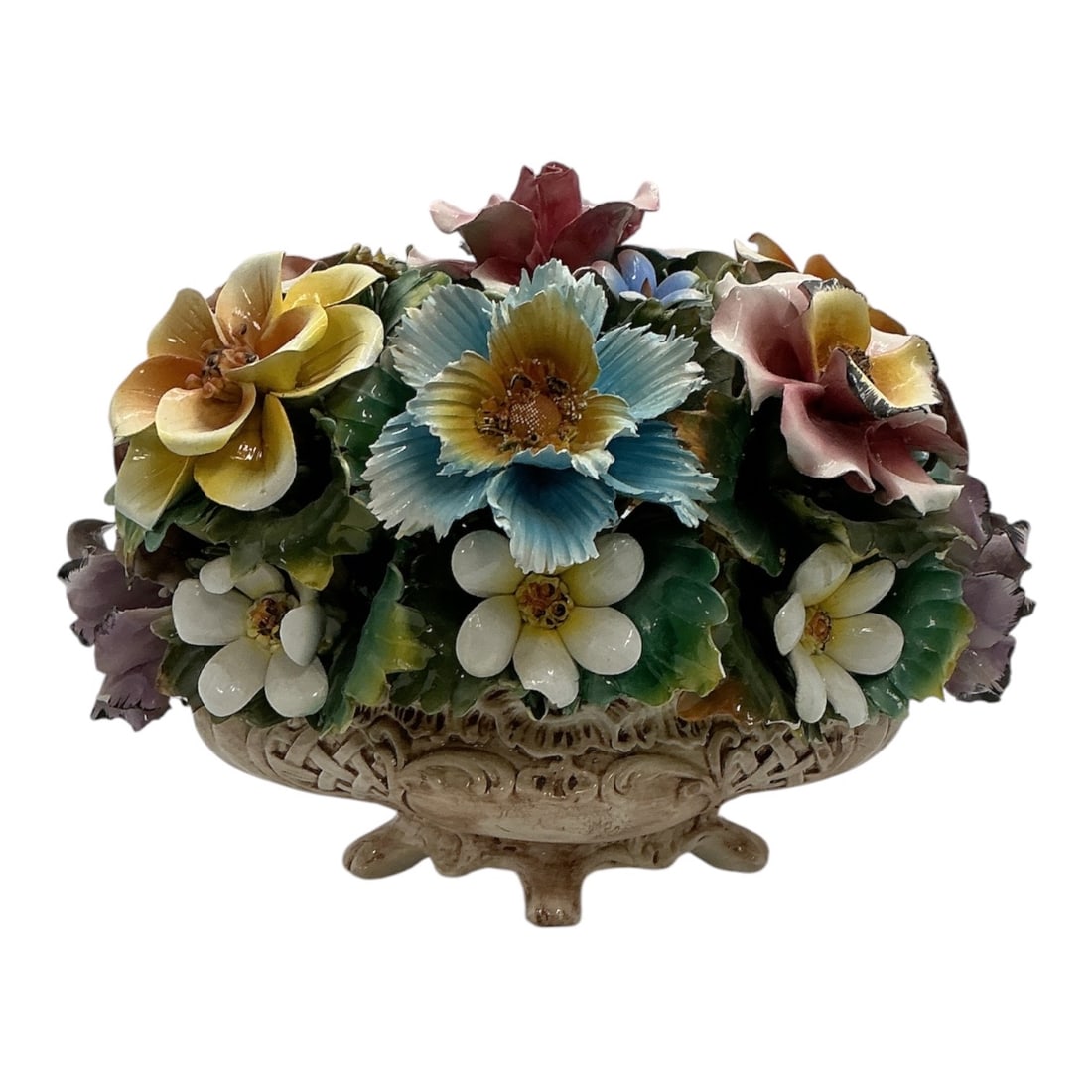Large Capodimonte Porcelain Floral Centerpiece: Large Capodimonte porcelain floral centerpiece featuring an abundant arrangement of hand-modeled blossoms in a decorative pierced pedestal basket. The composition includes beau