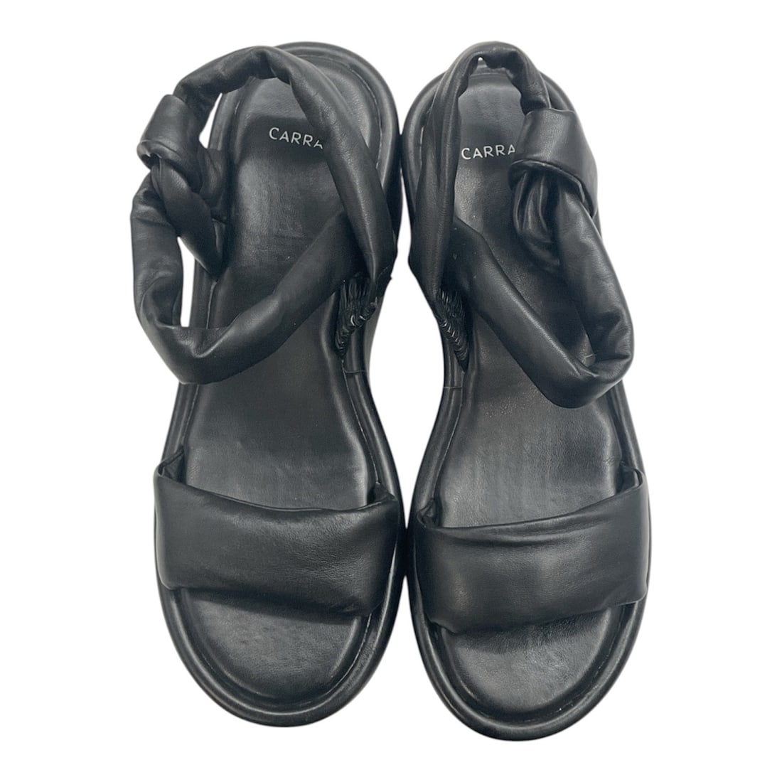 Carrano Black Leather Sandals: These Carrano women's sandals feature a contemporary black leather design with wide padded straps and a comfortable open-toe silhouette. The adjustable ankle strap provides