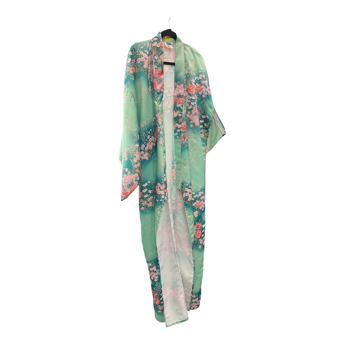 Floral Sheer Kimono Wrap: This lightweight sheer kimono wrap features a flowing silhouette adorned with an elegant floral print in shades of pink against a soft mint green background. Designed with an open front and relaxed dr