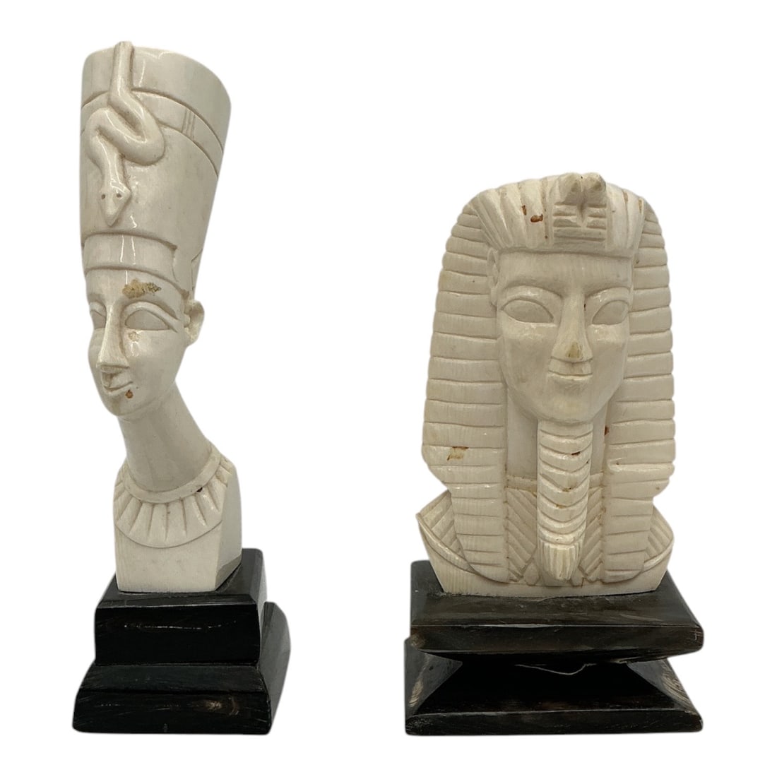 Egyptian Revival Carved Composite Busts of Nefertiti and Tutankhamun (Pair): Specifications Title: "Egyptian Revival Carved Composite Busts of Nefertiti and Tutankhamun" Maker: Unidentified Maker Medium: Carved composite material with dark wood bases Dimensions: