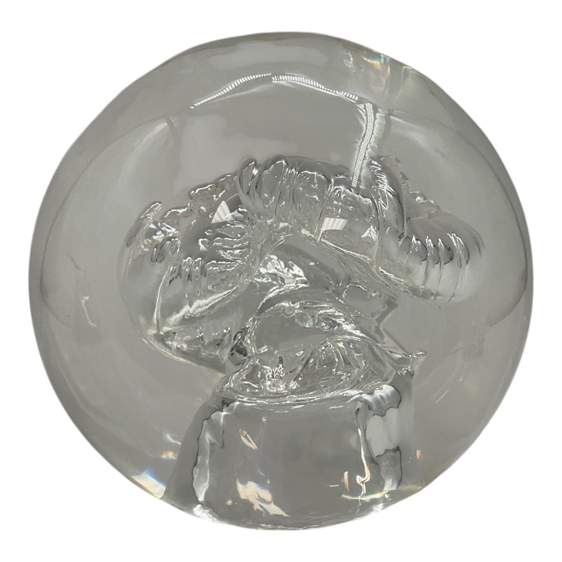 Large Clear Art Glass Relief Sculpture: Large decorative clear art glass sculpture featuring an intricate dimensional relief design encased within a substantial circular glass form. The deeply molded central composition displays elaborate s