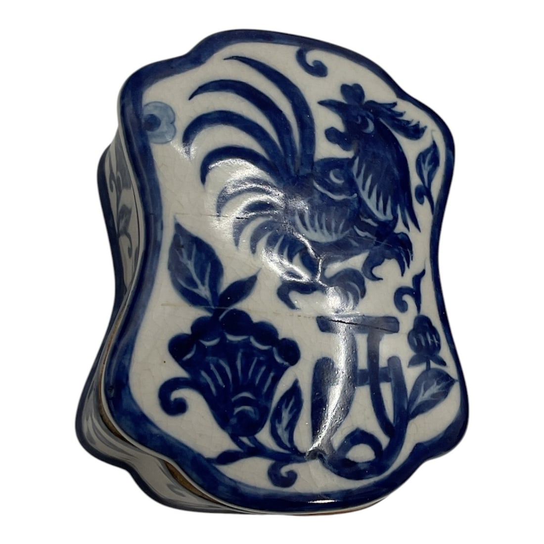Chinese Blue & White Porcelain Rooster Trinket Box: Decorative Chinese blue and white porcelain trinket box featuring an unusual shaped form with a fitted removable lid. The hand-painted style decoration depicts a prominent rooster surrounded by styliz