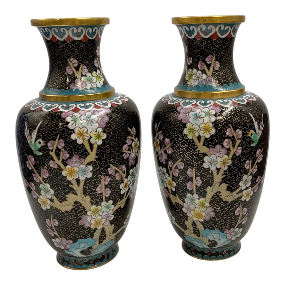 Pair of Chinese Cloisonné Floral Vases with Black Ground: Pair of decorative Chinese cloisonné vases featuring elegant baluster forms with flared necks and a rich black ground. Each vase is intricately decorated with colorful flowering branches, bloss