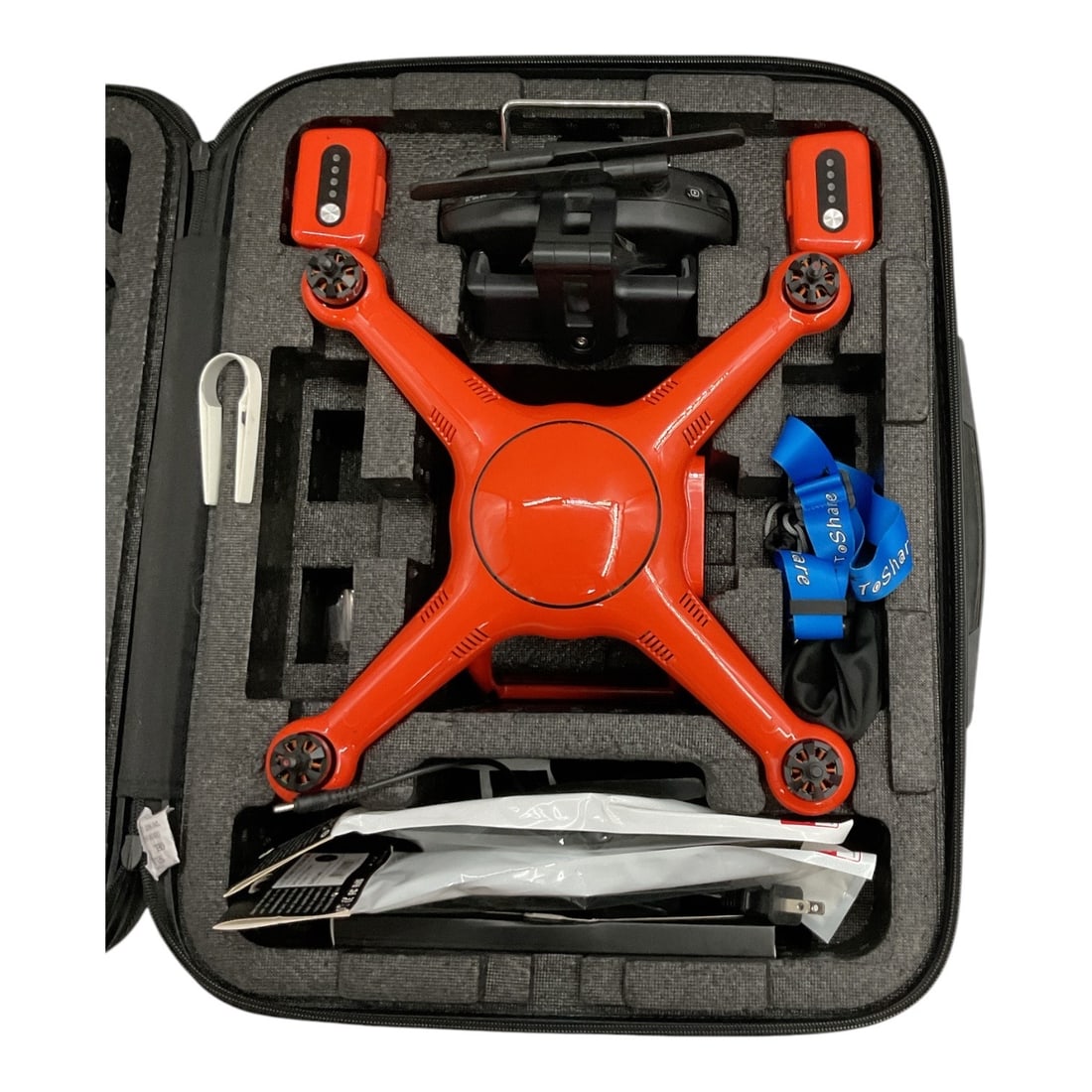 Autel Robotics X-Star Premium 4K Camera Drone with Remote Controller & Hard Case: Autel Robotics X-Star Premium quadcopter drone in the distinctive orange finish, accompanied by its remote controller, fitted Autel Robotics carrying case, propellers, and assorted accessories as show