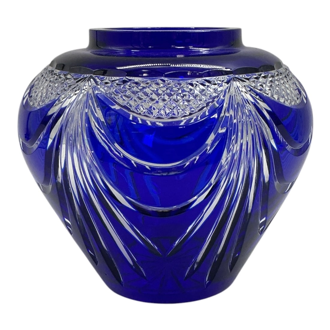 Blue Cut Crystal Vase: Cobalt blue 24% lead crystal bulbous vase featuring cut-to-clear draped fan motifs, diamond crosshatch borders, and a short tapered neck.