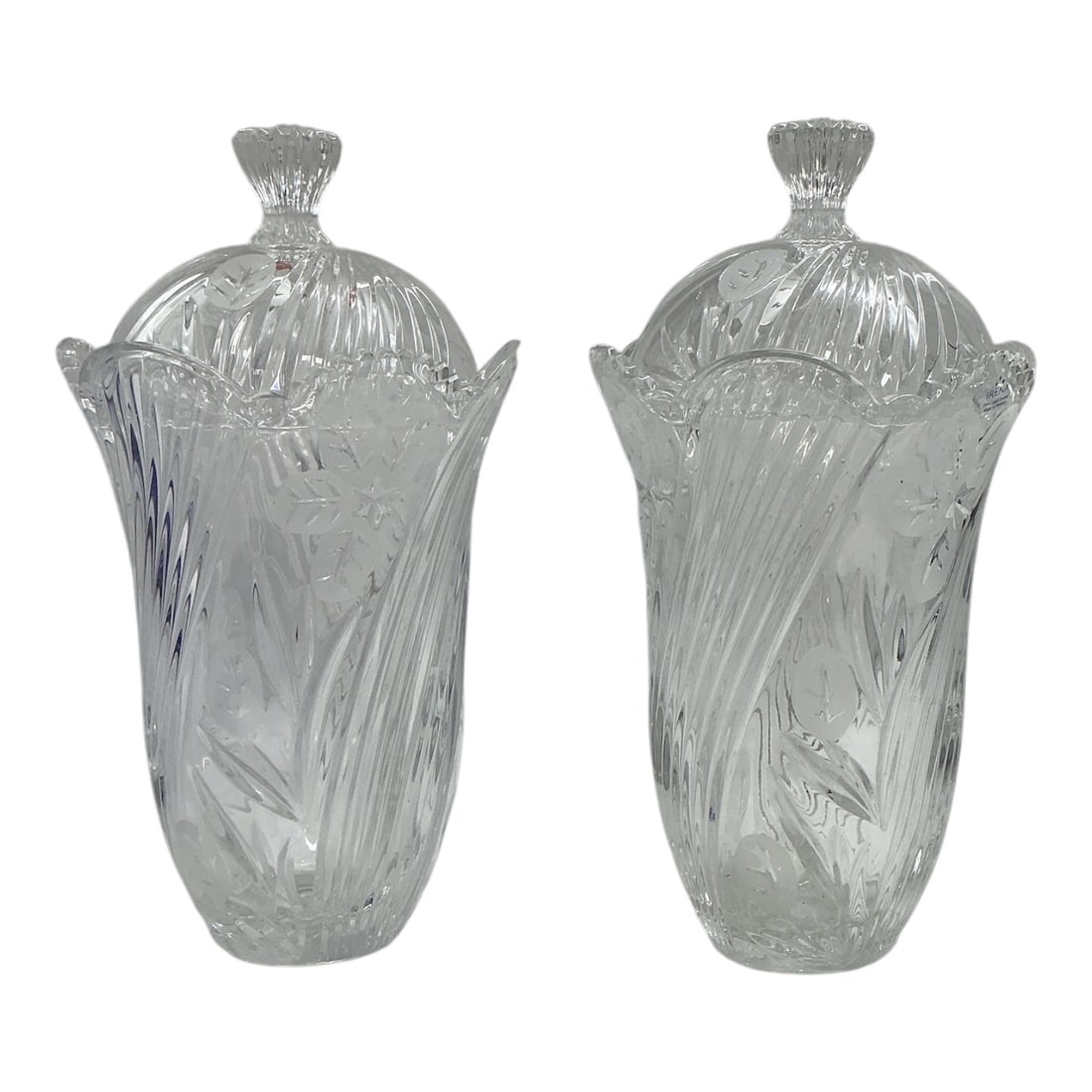 Cut Crystal Covered Urns Set of 2 by Irena 24% Lead Crystal: Clear 24% lead crystal pair of covered urns featuring frosted floral and leaf motifs, vertical fluting, scalloped rims, and matching domed lids with faceted finials.