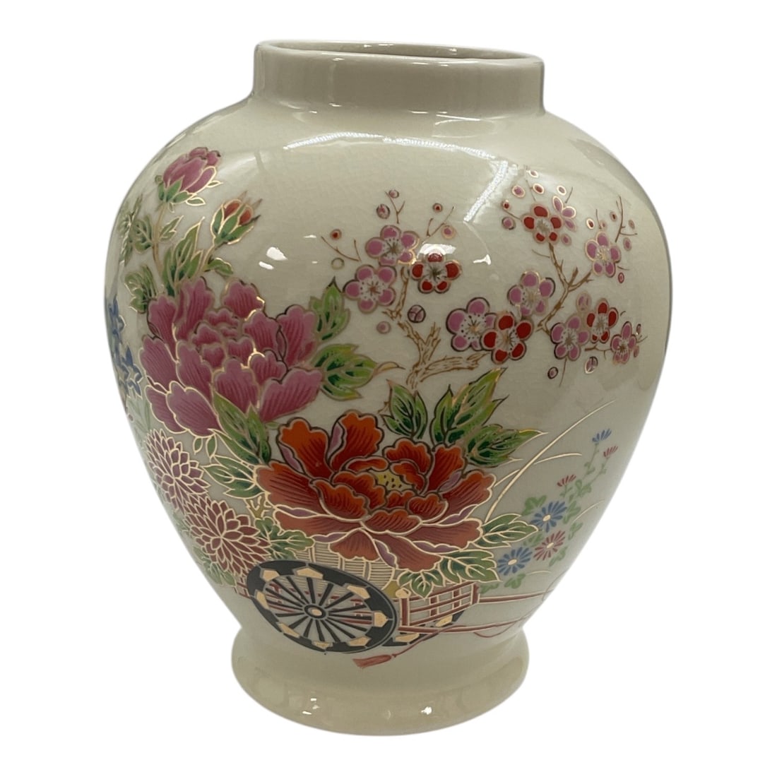 Japanese Satsuma-Style Floral Porcelain Vase: Decorative Japanese Satsuma-style porcelain vase featuring a rounded ovoid body with short neck and pedestal foot. The cream-colored ground is richly decorated with colorful peonies, chrysanthemums, f
