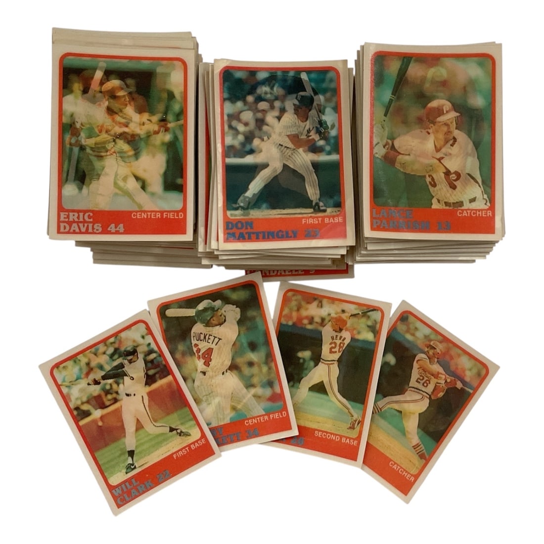 Vintage Fleer Baseball Trading Card Collection: Collection of vintage Fleer baseball trading cards featuring assorted Major League Baseball players and teams. The cards display classic red-bordered designs with player photography, names, positions,