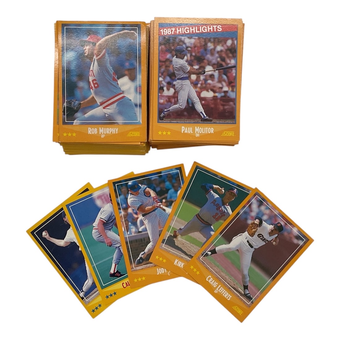 1987 Donruss Baseball Trading Card Collection: Collection of 1987 Donruss baseball trading cards featuring assorted Major League Baseball players and 1987 Highlights cards. The cards display the recognizable yellow-gold bordered design associated 