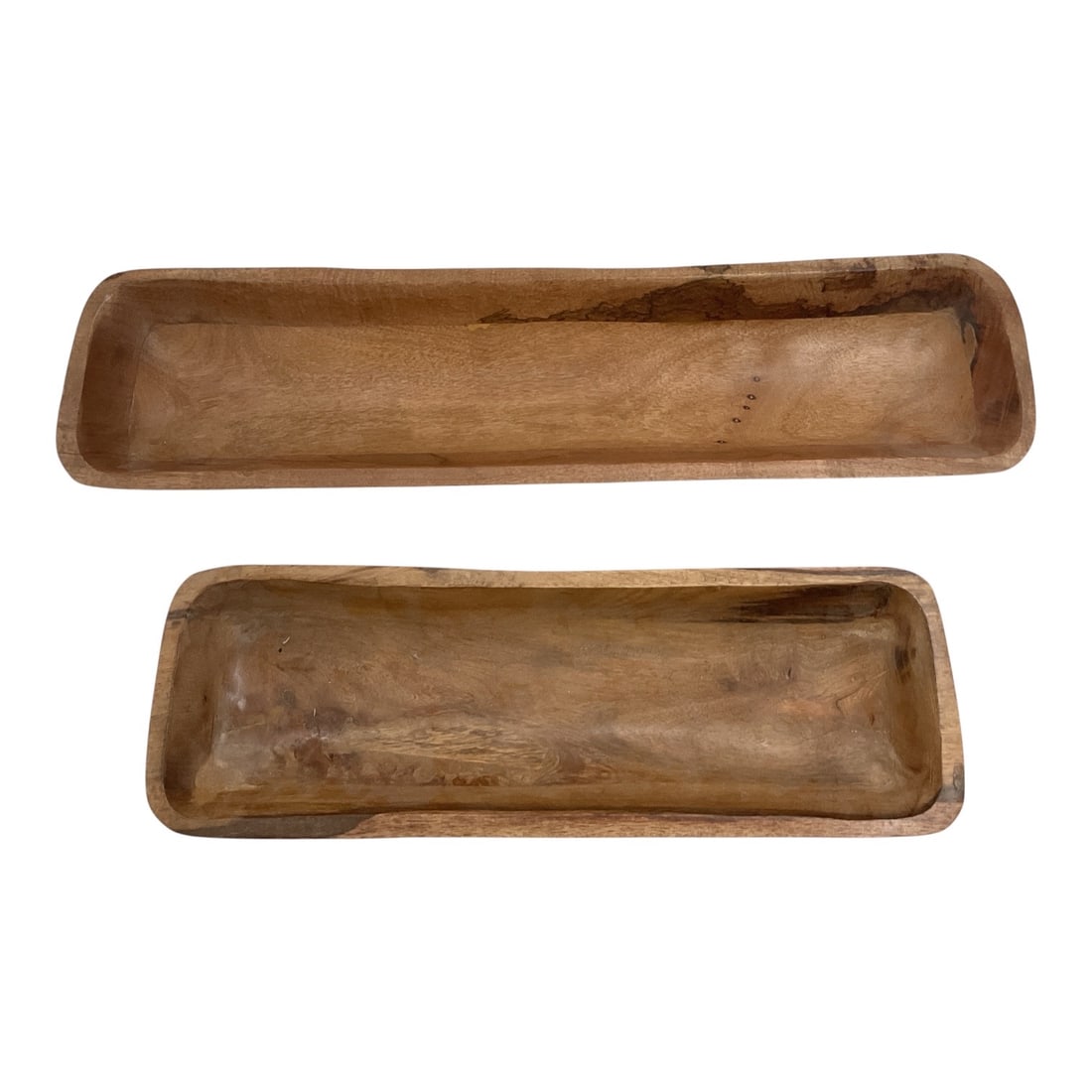 Pair of Primitive Carved Wooden Dough Trencher Bowls: Pair of elongated wooden dough or trencher bowls featuring shallow carved interiors, rounded ends, and a rustic natural wood finish. Each displays variations in grain, coloration, surface texture,