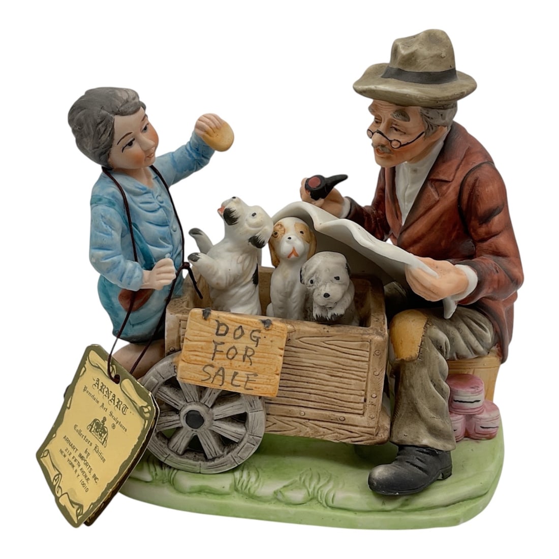 Capodimonte Porcelain Figural Group Boy Selling Puppies: A Capodimonte porcelain figural group depicting a charming street scene with a young boy offering puppies for sale to an older gentleman seated beside a cart. The composition includes multiple