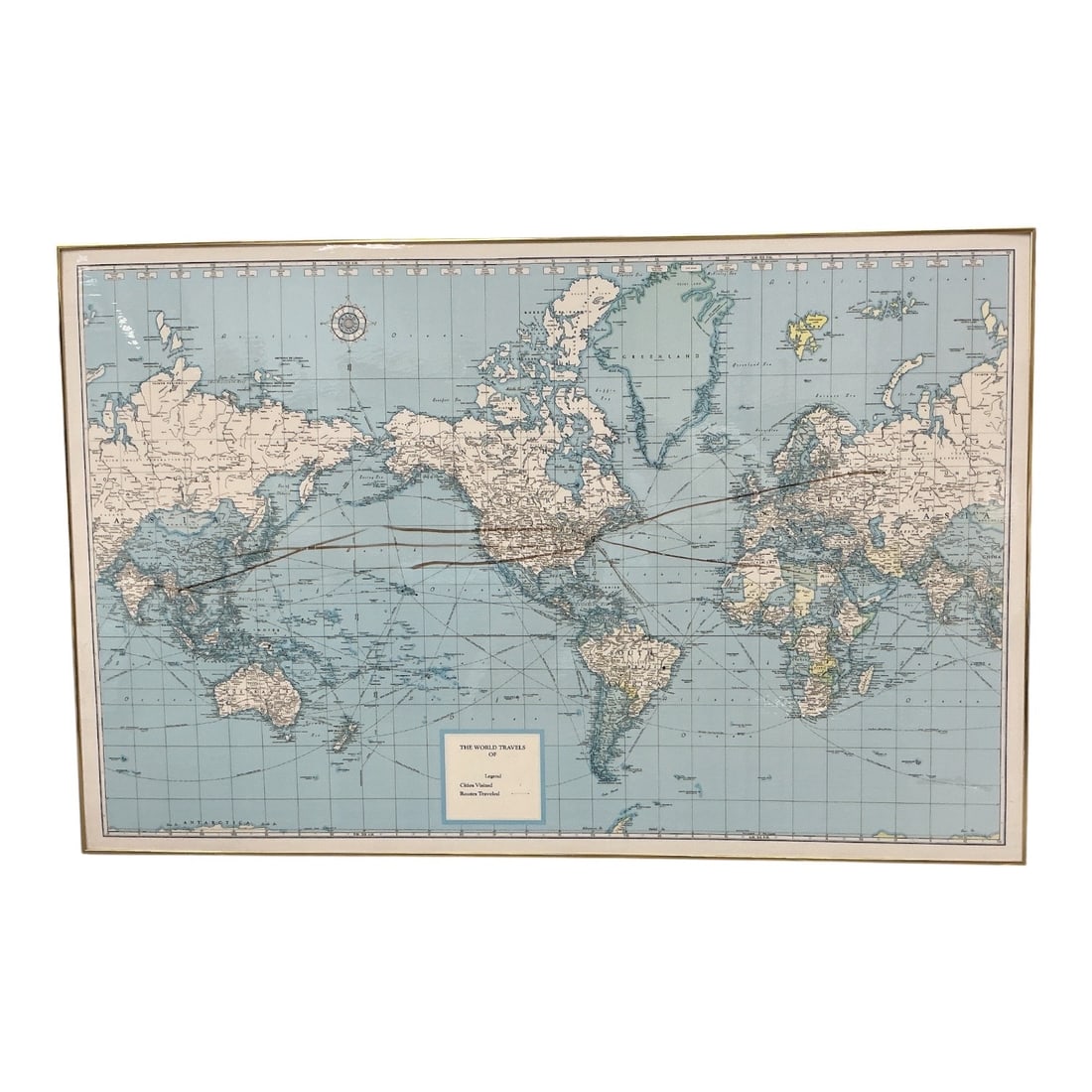 Framed Vintage World Map Educational Wall Chart: Large framed vintage world map printed in soft blue, tan, and cream tones, illustrating countries, major cities, oceans, latitude and longitude lines, and international boundaries. Designed in the