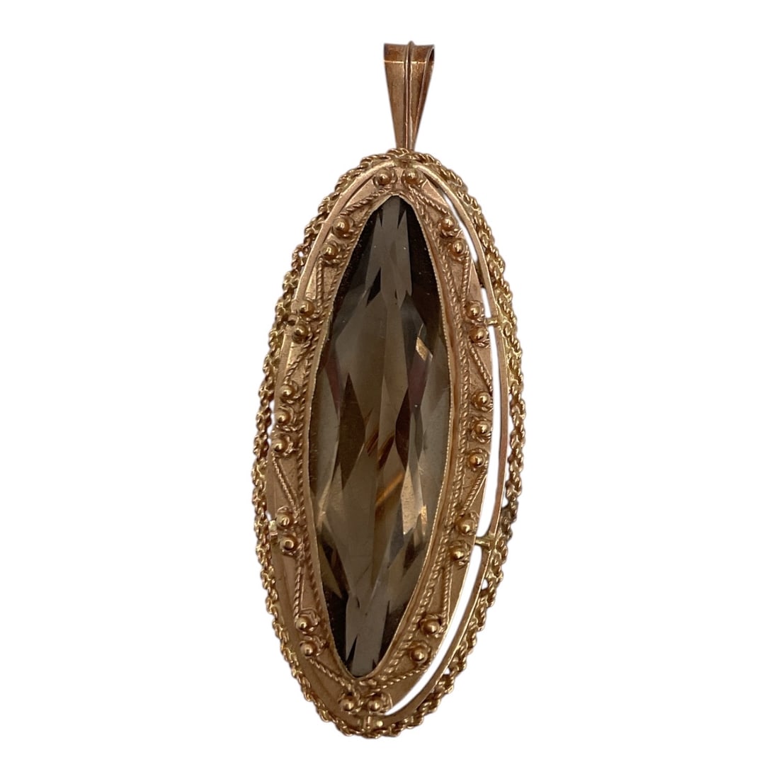 Vintage 14K Yellow Gold Marquise Smoky Quartz Pendant: Vintage 14K yellow gold pendant featuring a large faceted marquise-cut smoky quartz gemstone. The elongated stone displays rich smoky brown tones and is set within an ornate textured gold frame, creat