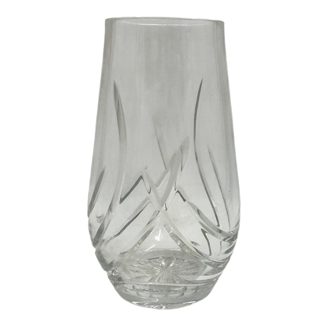 Cut Crystal Vase: Clear cut crystal vase featuring a cylindrical body with sweeping curved cut motifs and a starburst cut base. Materi