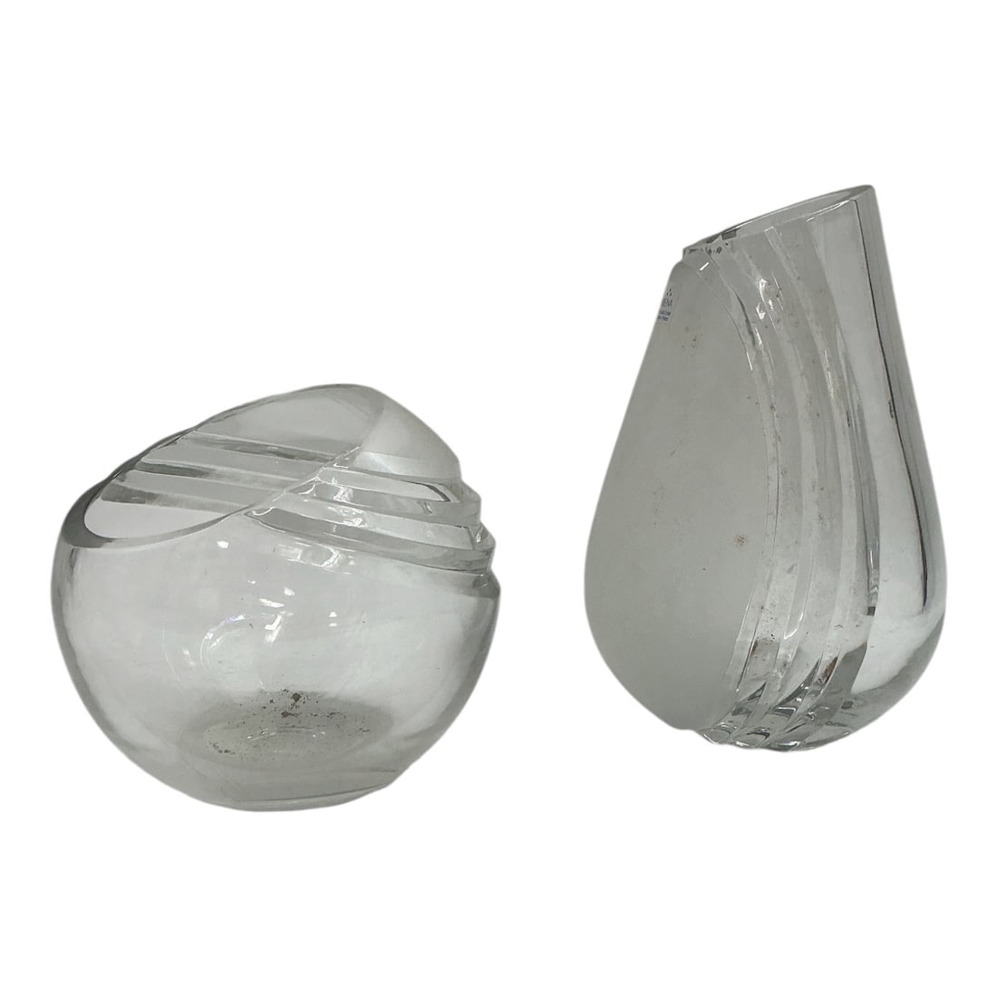 Cut Crystal Vases Set of 2 by Irena 24% Lead Crystal: Clear 24% lead crystal pair of modern art glass vases featuring organic teardrop and asymmetrical curved silhouettes with banded cut line accents. Material: 24% lead crystal Origin: Poland Design: