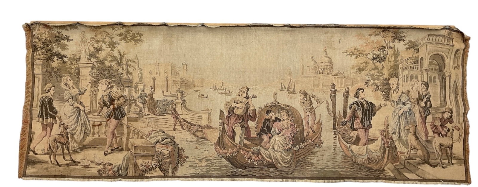 Vintage European Figural Tapestry Wall Hanging: Vintage woven tapestry wall hanging featuring an elaborate European-style figural scene with numerous figures gathered around a central carriage or ceremonial procession. The composition includes arch
