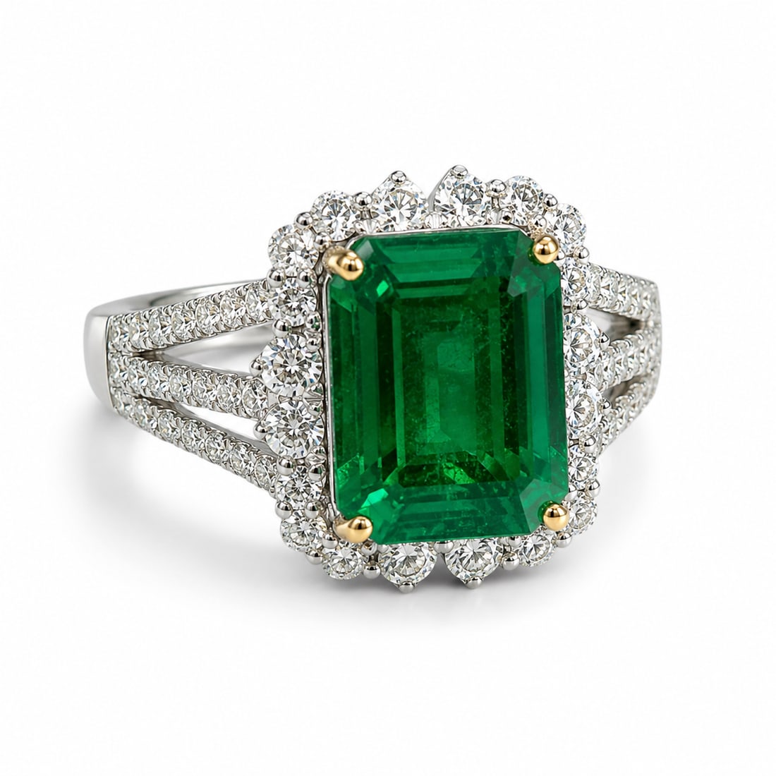 14K White Gold Natural Emerald & Diamond Ring with AIGL Appraisal: Elegant 14K white gold ring featuring a large emerald-cut natural emerald secured by contrasting yellow gold prongs. The vivid green center stone is surrounded by a sparkling halo of round brilliant-c
